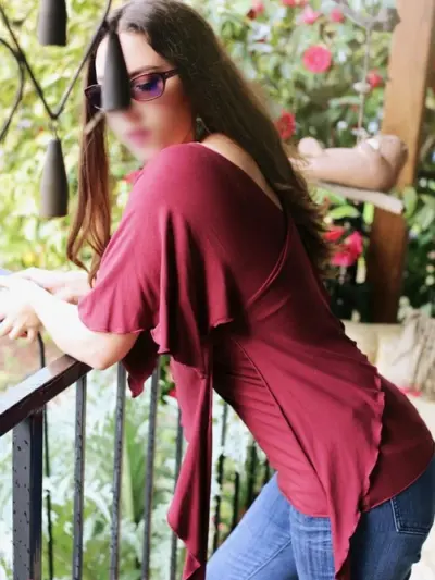 Leah-Lindsay-Burgundy-Top-Leaning-on-Railing